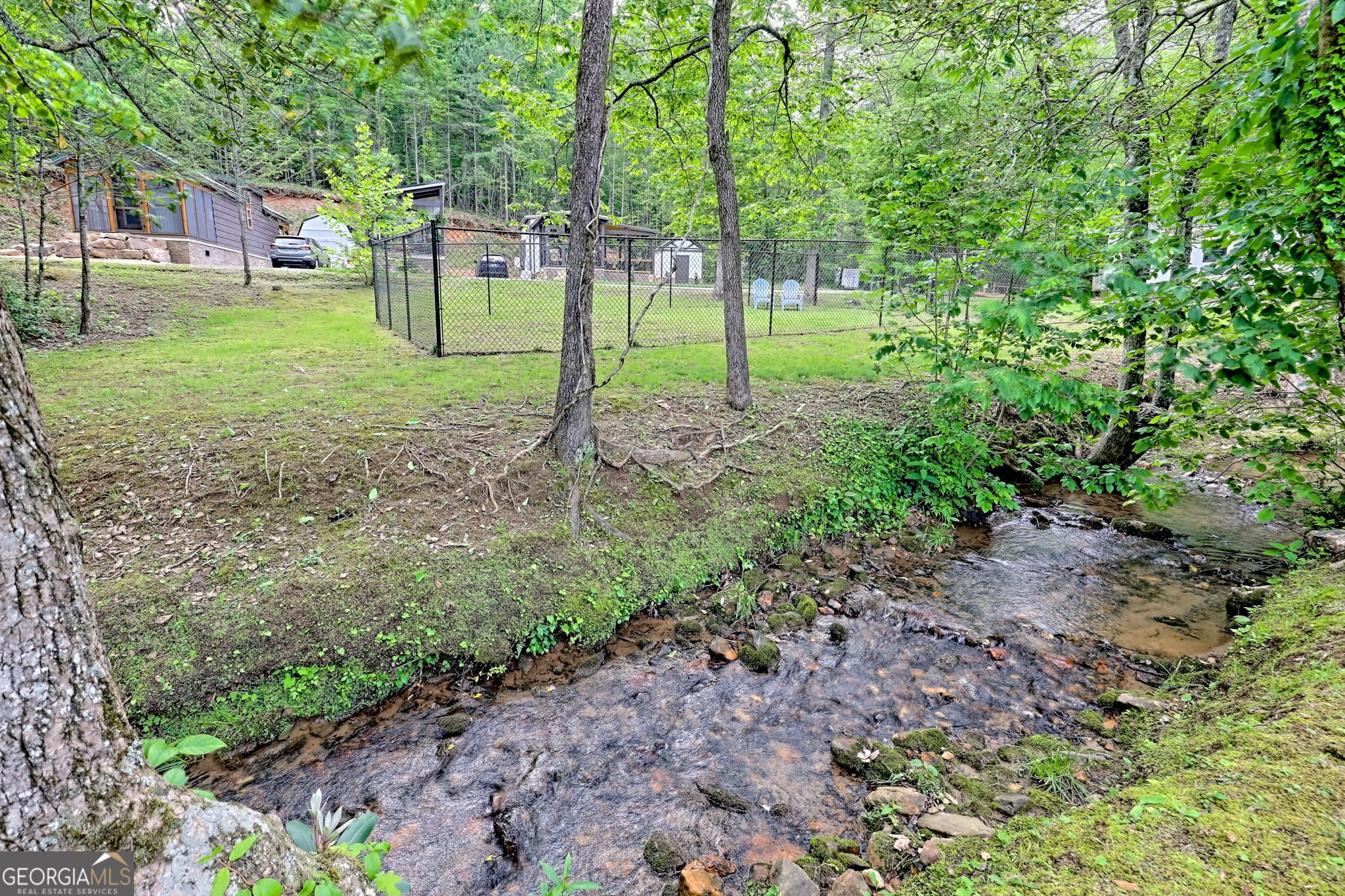 4960 Laurel Lodge Road Clarkesville, GA 30523 - Photo 25 of 29 a view of a backyard with green space