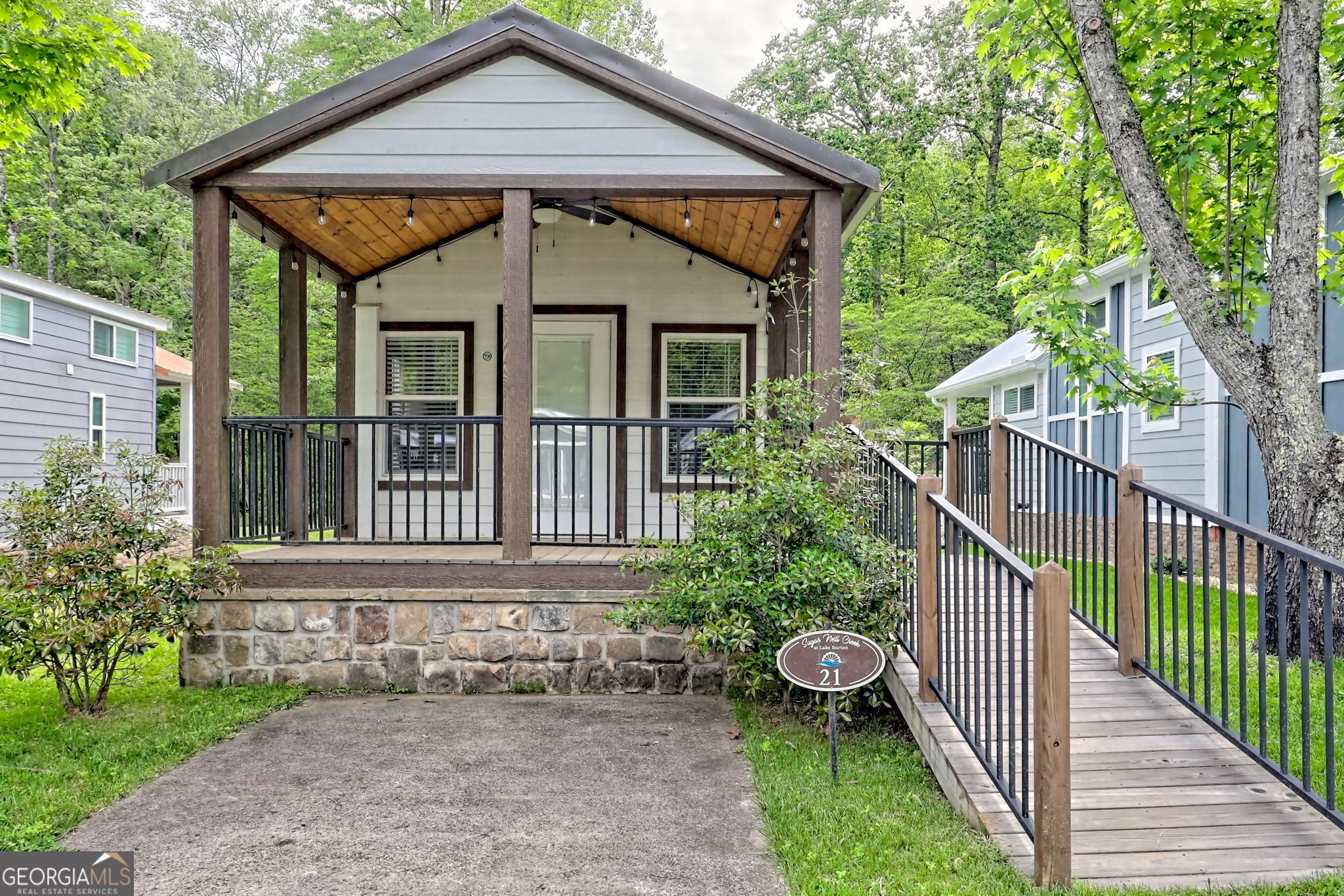 4960 Laurel Lodge Road Clarkesville, GA 30523 - Photo 27 of 29 a front view of a house with a yard