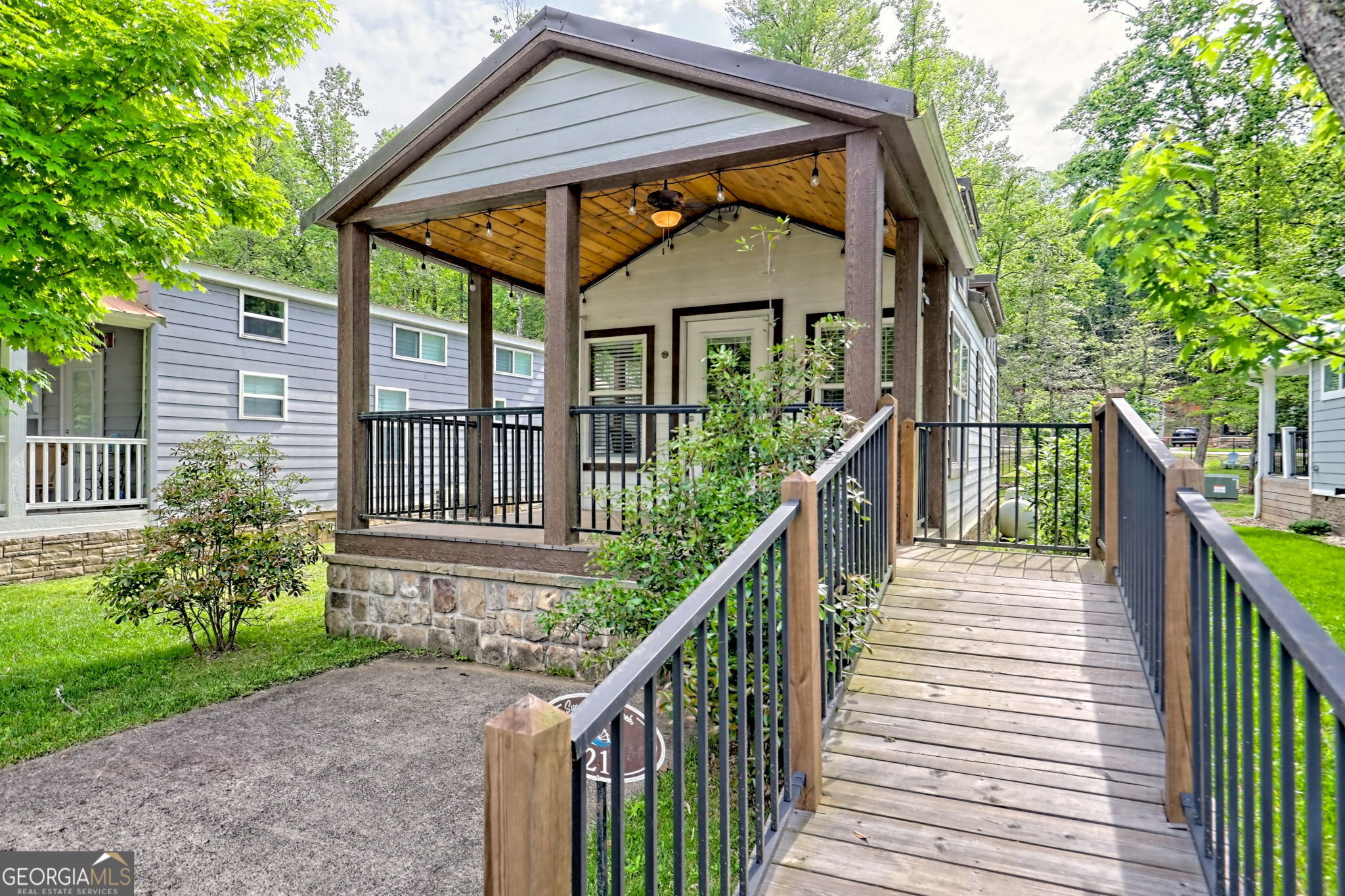4960 Laurel Lodge Road Clarkesville, GA 30523 - Photo 29 of 29 a view of house with a deck and furniture