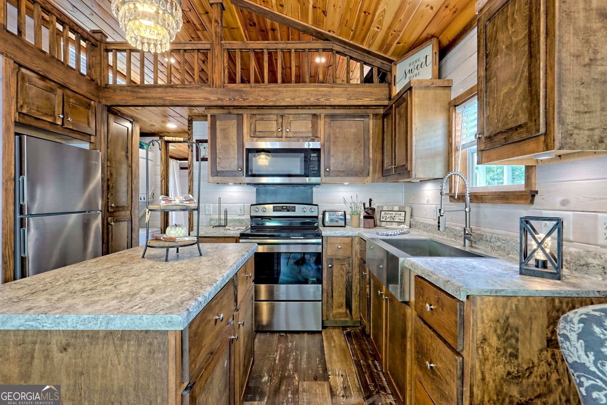 4960 Laurel Lodge Road Clarkesville, GA 30523 - Photo 7 of 29 a kitchen with stainless steel appliances granite countertop a sink a stove and a refrigerator