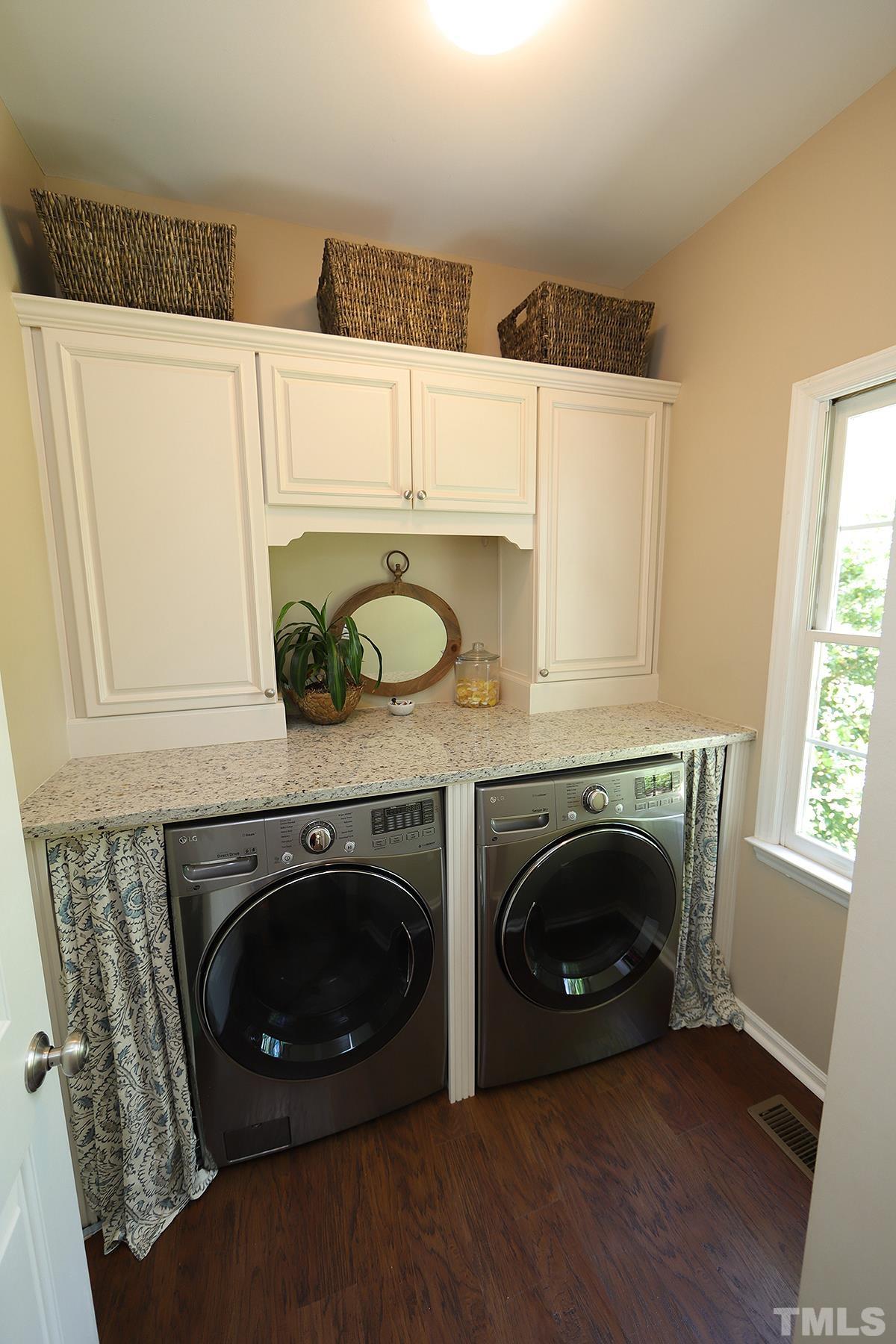 5152 Fairmead Circle Raleigh, NC 27613 - Photo 11 of 25 a utility room with dryer and washer