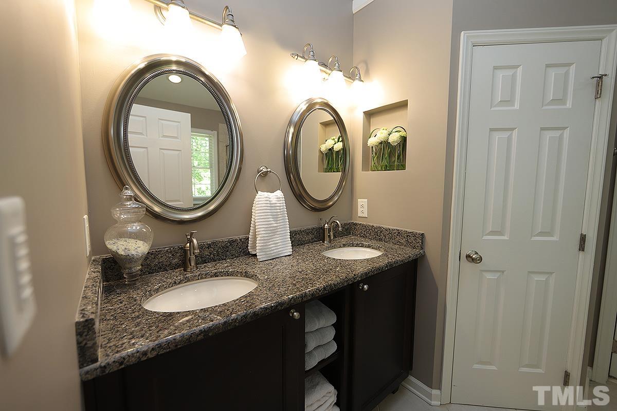 5152 Fairmead Circle Raleigh, NC 27613 - Photo 13 of 25 a bathroom with a granite countertop double vanity sink and a mirror