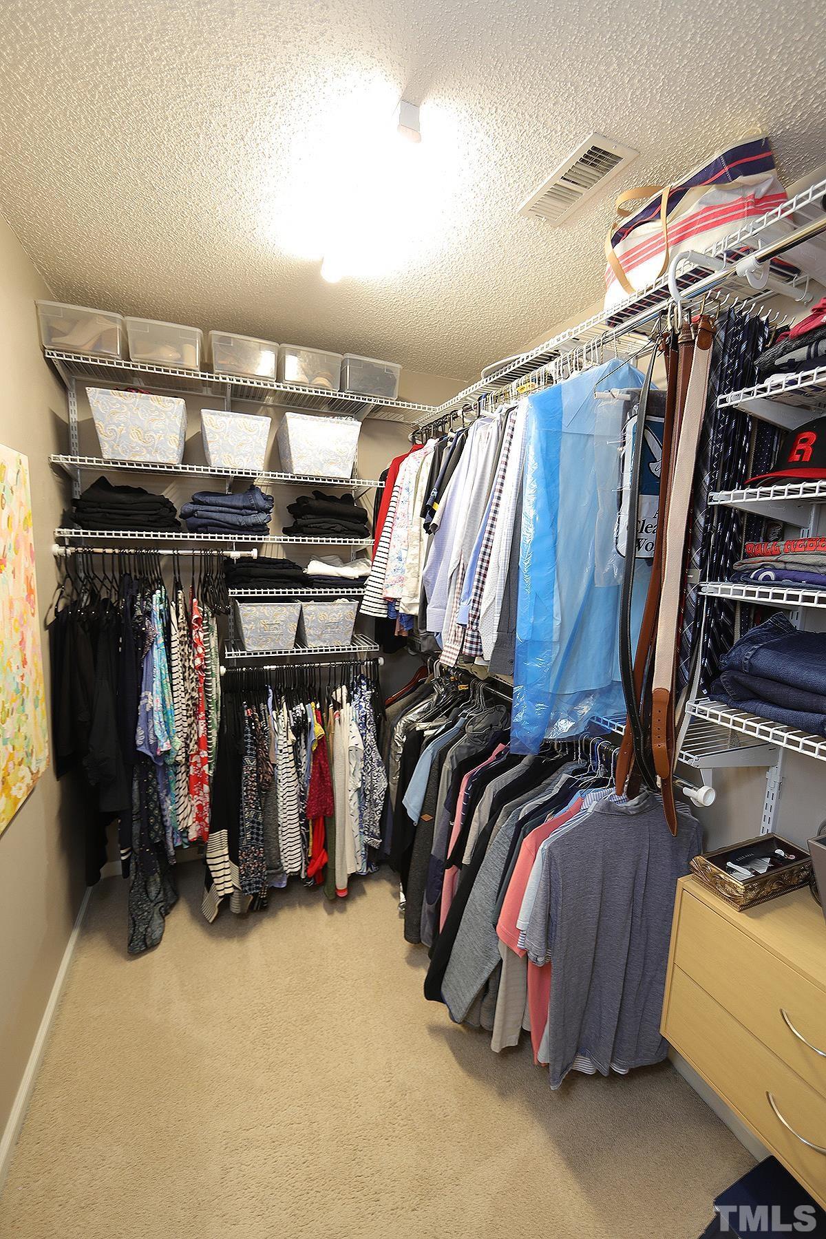 5152 Fairmead Circle Raleigh, NC 27613 - Photo 15 of 25 a view of walk in closet with clothes and shoes