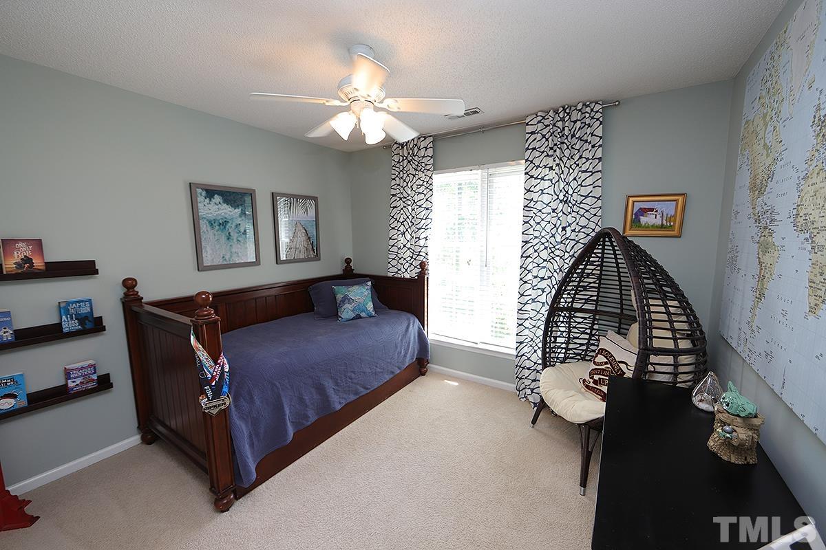 5152 Fairmead Circle Raleigh, NC 27613 - Photo 18 of 25 a living room with furniture and a window