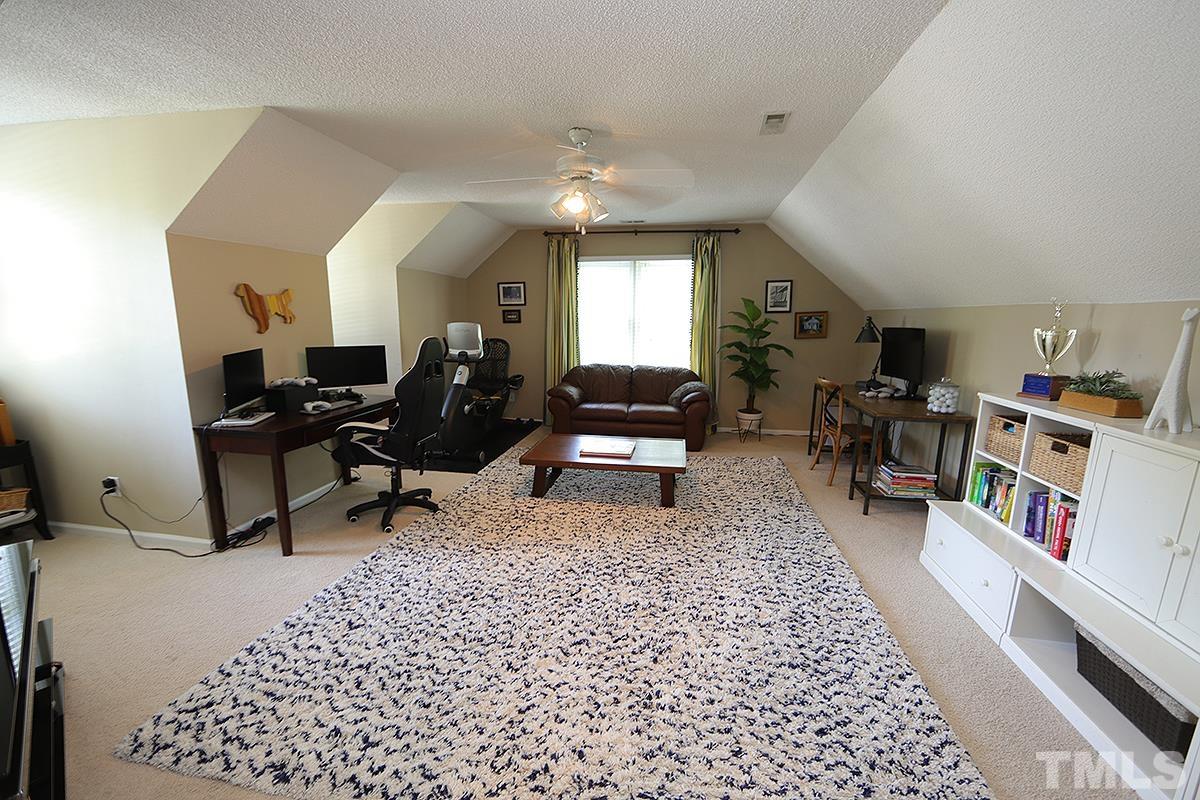 5152 Fairmead Circle Raleigh, NC 27613 - Photo 19 of 25 a living room with furniture and a wooden floor