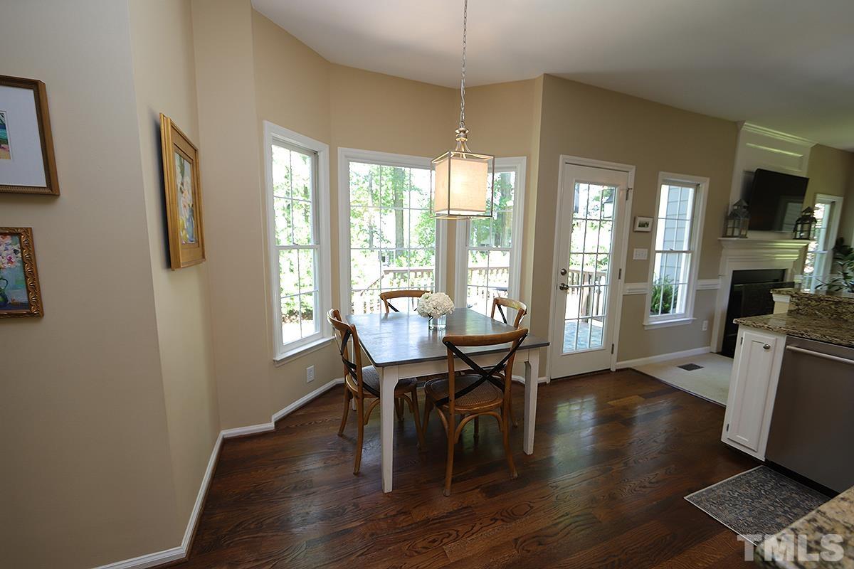 5152 Fairmead Circle Raleigh, NC 27613 - Photo 10 of 25 a view of a dining room with furniture window and wooden floor