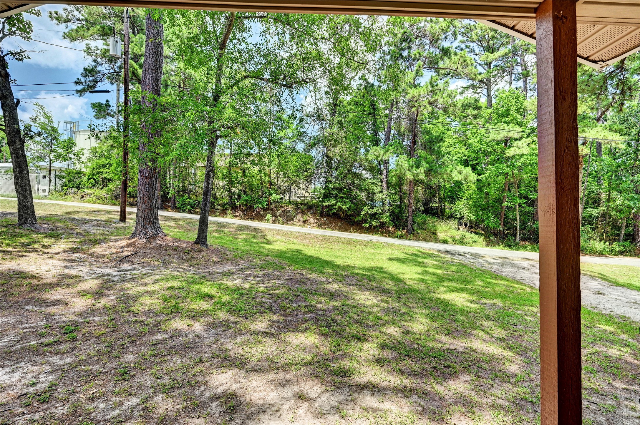 6 Hickory Hollow Road Huntsville, TX 77320 - Photo 38 of 44 a view of a yard with a tree