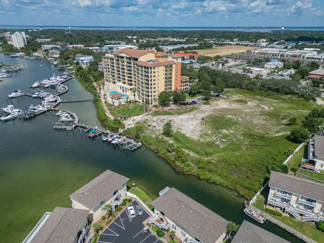 an aerial view of a house with a lake view