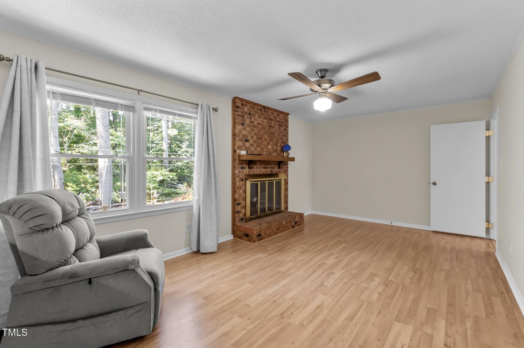 6401 Wrenwood Avenue Raleigh, NC 27607 - Photo 13 of 32 a living room with furniture and a large window