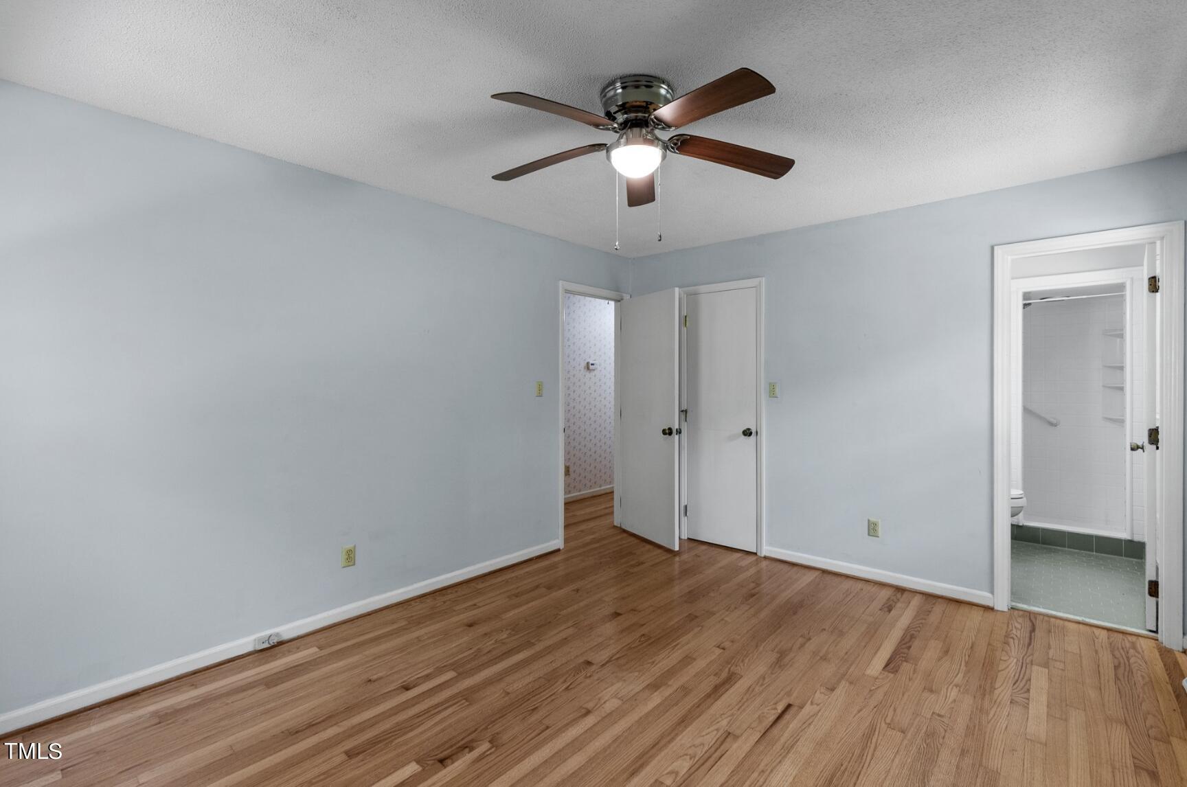 6401 Wrenwood Avenue Raleigh, NC 27607 - Photo 17 of 32 an empty room with wooden floor and windows