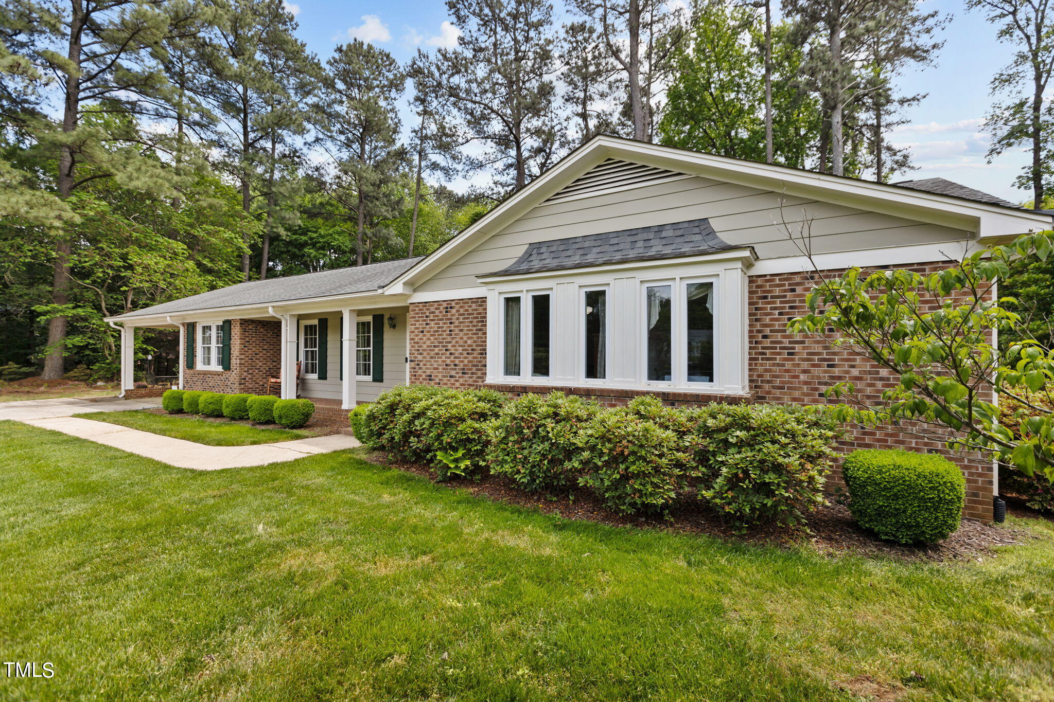 6401 Wrenwood Avenue Raleigh, NC 27607 - Photo 2 of 32 a view of a house with backyard and garden