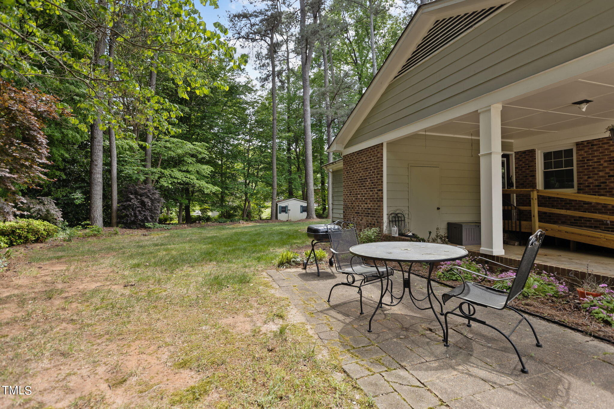 6401 Wrenwood Avenue Raleigh, NC 27607 - Photo 25 of 32 a backyard of a house with table and chairs