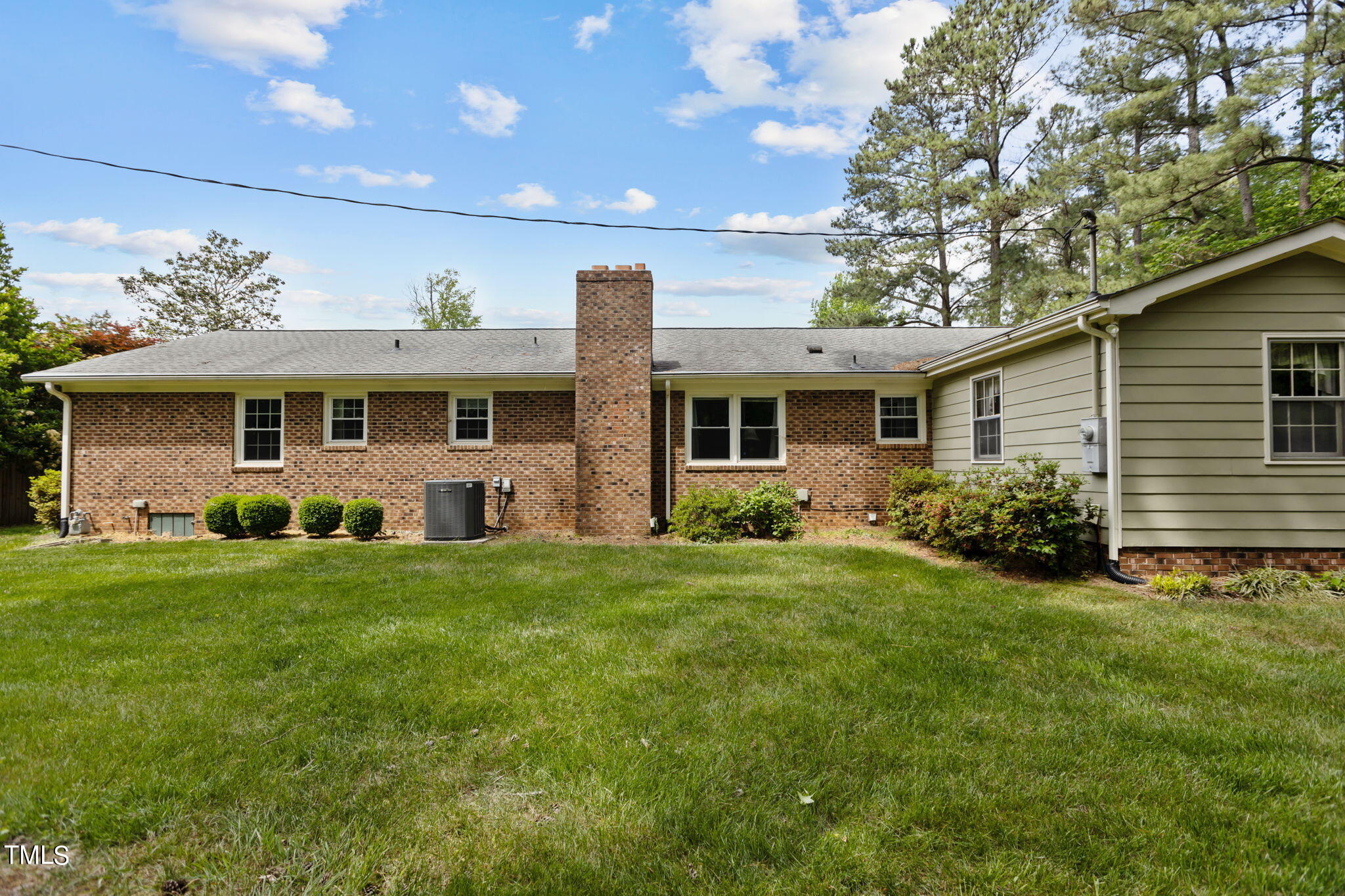 6401 Wrenwood Avenue Raleigh, NC 27607 - Photo 27 of 32 a front view of a house with a yard