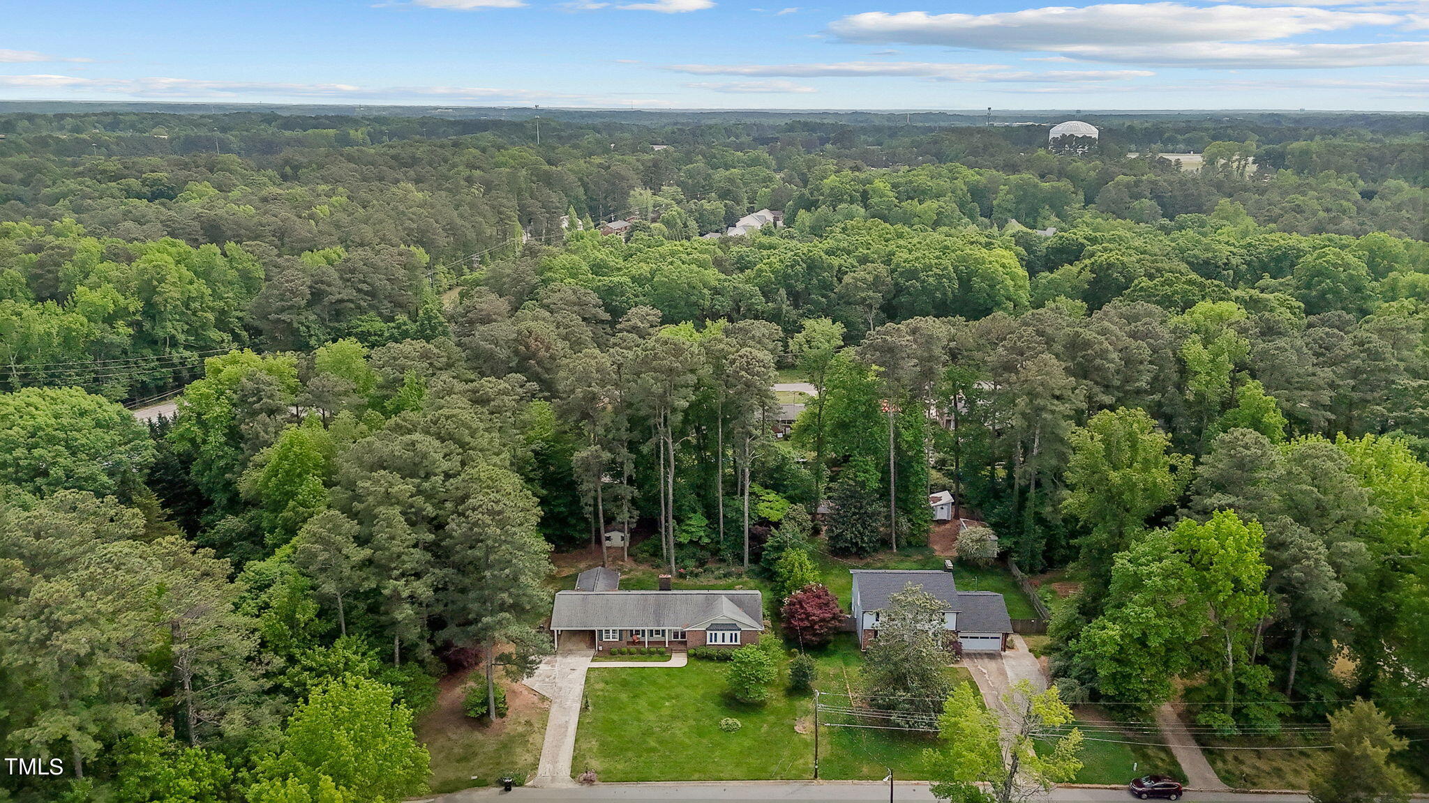 6401 Wrenwood Avenue Raleigh, NC 27607 - Photo 30 of 32 an aerial view of residential houses with outdoor space and trees