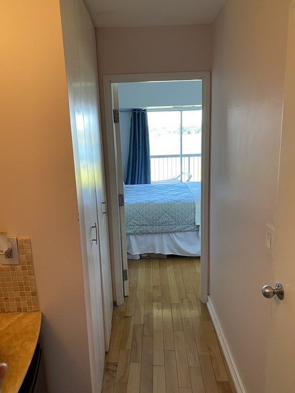 133 Commander Shea Boulevard, Unit 711 Quincy, MA 02171 - Photo 17 of 21 a view of front door with wooden floor