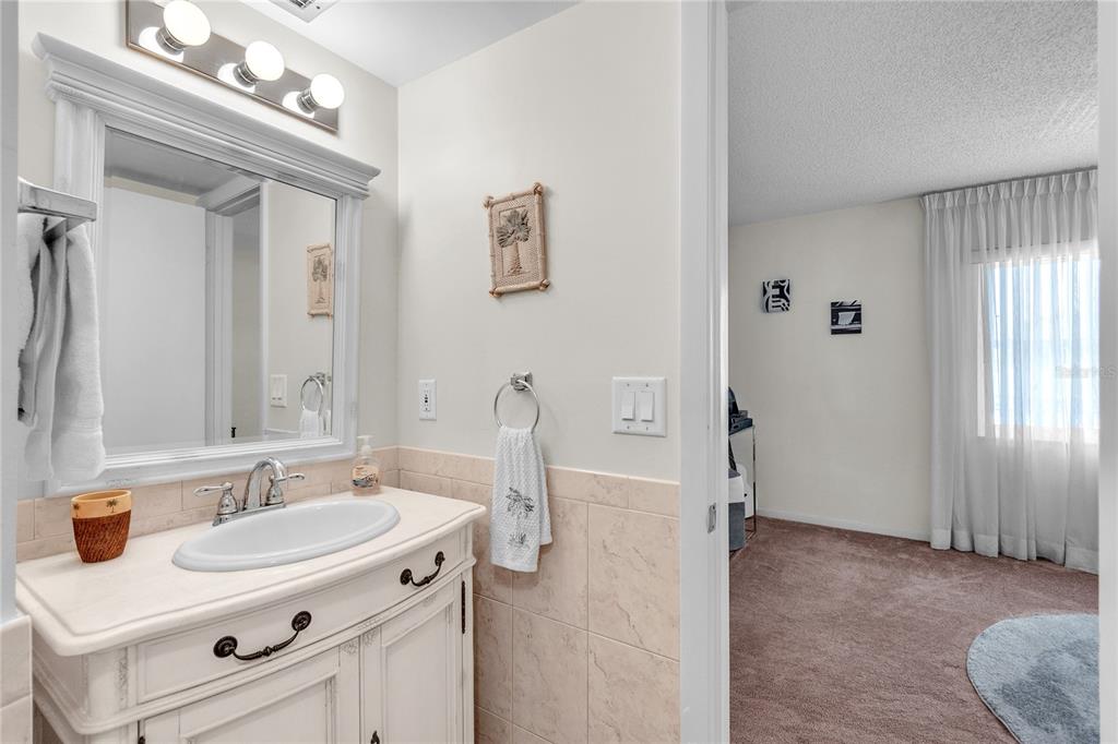 12200 Vonn Road, Unit 2206 Largo, FL 33774 - Photo 47 of 60 a spacious bathroom with a sink double vanity and a mirror