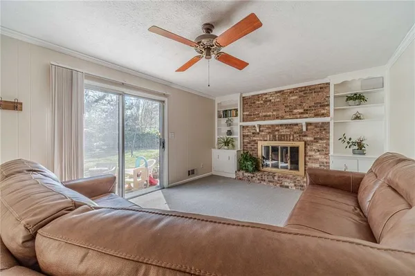 a bedroom with a bed and a potted plant