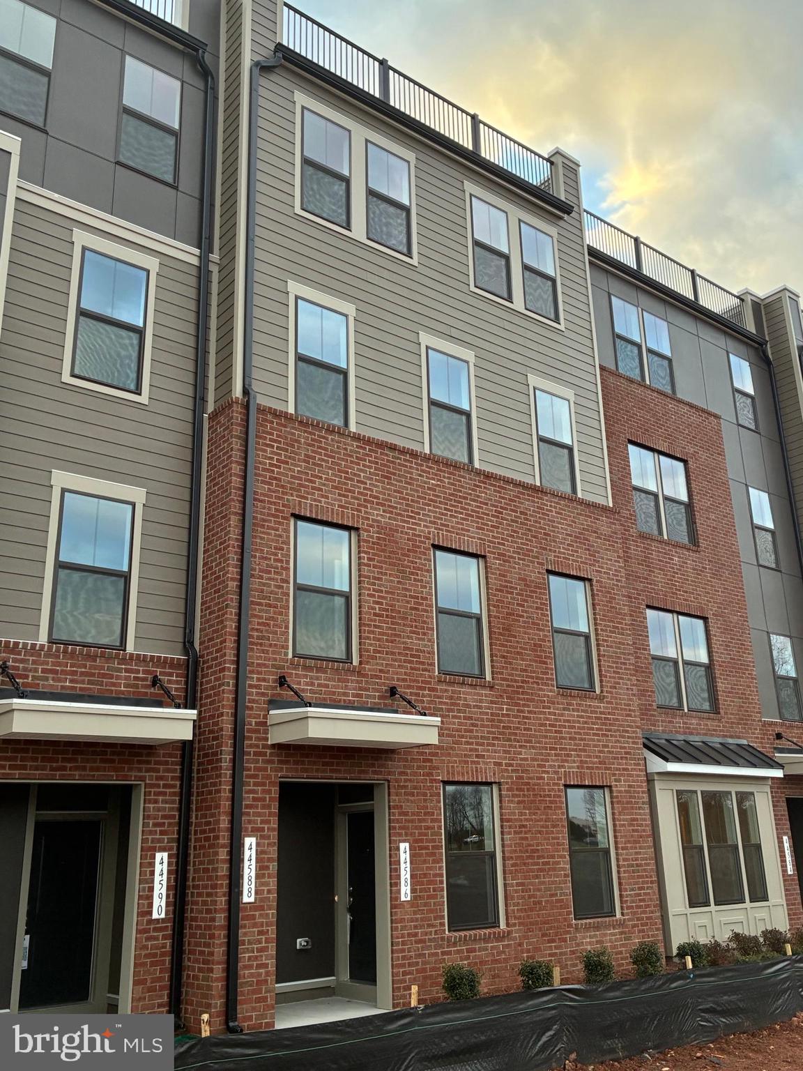 44586 Strabane Terrace Ashburn, VA 20147 - Photo 1 of 15 a front view of a building