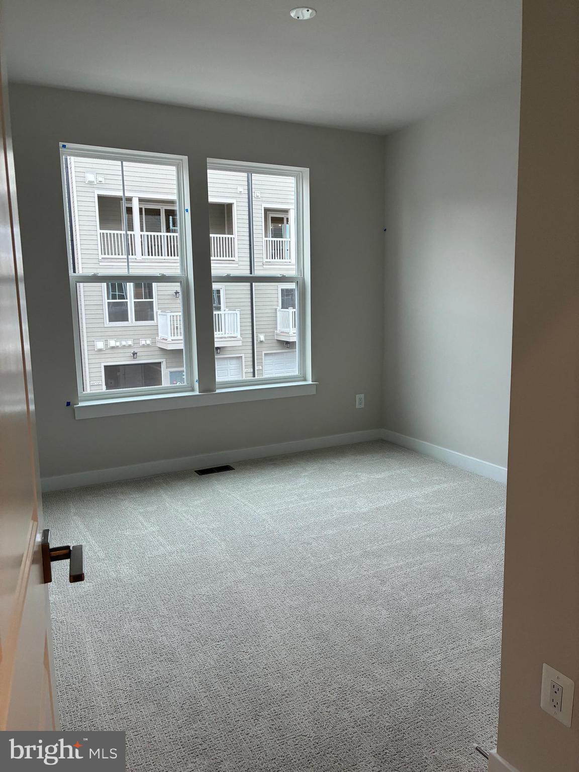 44586 Strabane Terrace Ashburn, VA 20147 - Photo 11 of 15 an empty room with windows