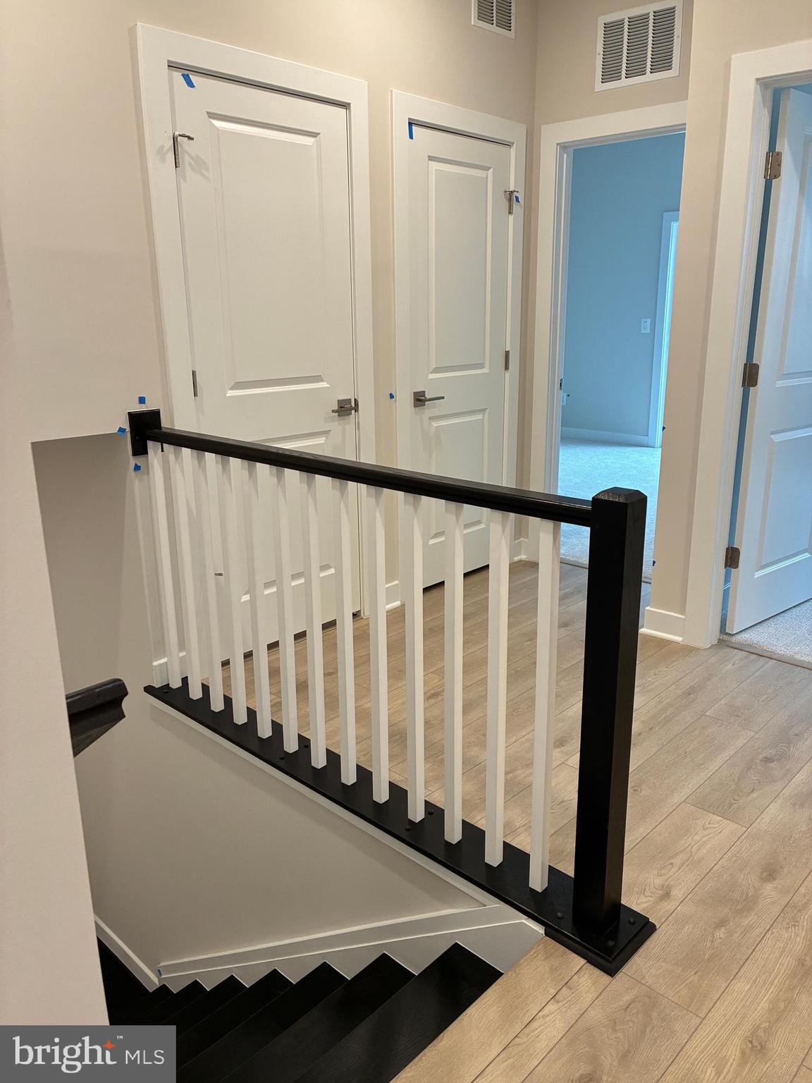 44586 Strabane Terrace Ashburn, VA 20147 - Photo 12 of 15 a view of staircase with wooden floor