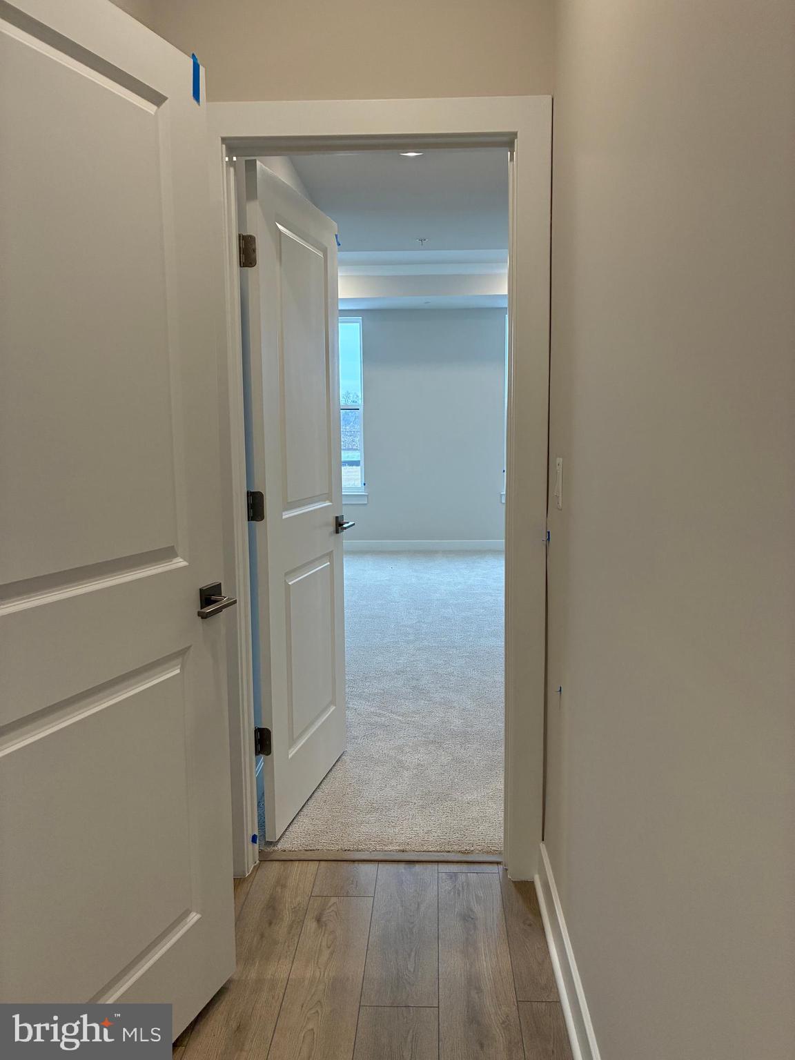 44586 Strabane Terrace Ashburn, VA 20147 - Photo 8 of 15 a view of a hallway with wooden floor