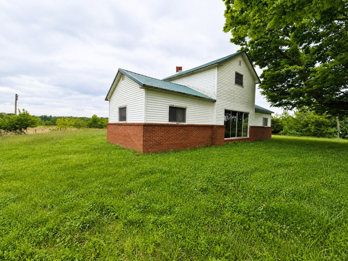8545 Southeast Jeff Road Warren, IN 46792 - Photo 3 of 8 a house view with a garden space