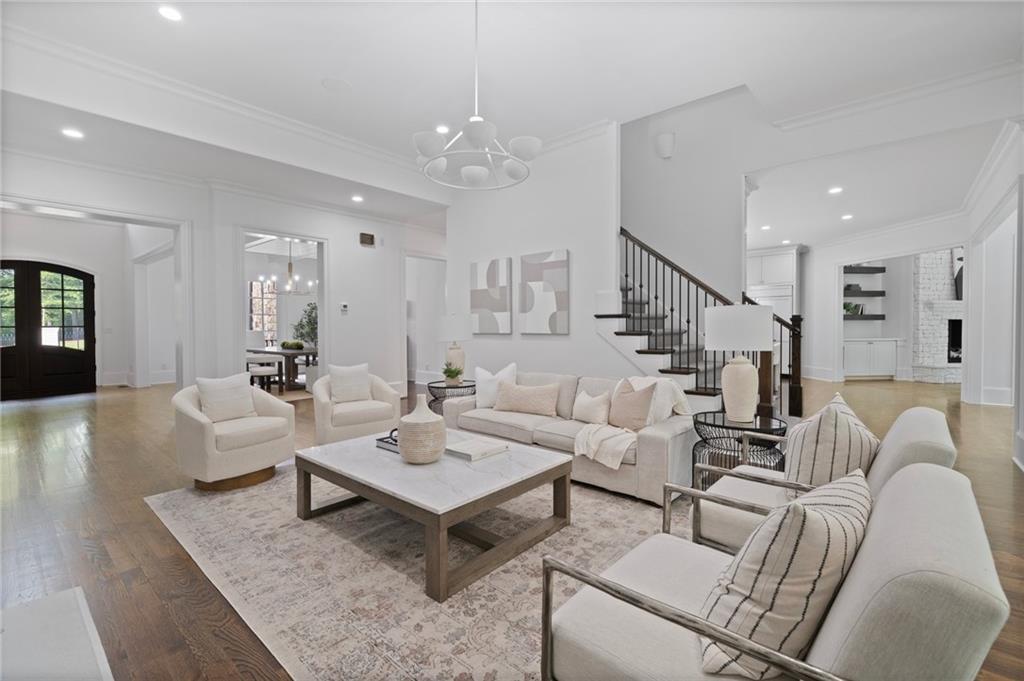3213 Balley Forrest Drive Milton, GA 30004 - Photo 14 of 90 a living room with furniture and a wooden floor