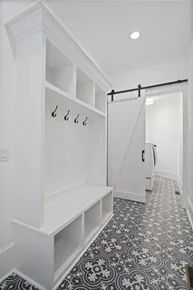 an empty room with a ceiling fan and window