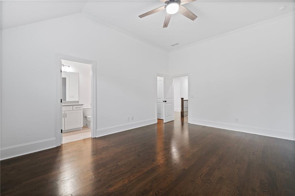 3213 Balley Forrest Drive Milton, GA 30004 - Photo 50 of 90 an empty room with wooden floor and ceiling fan