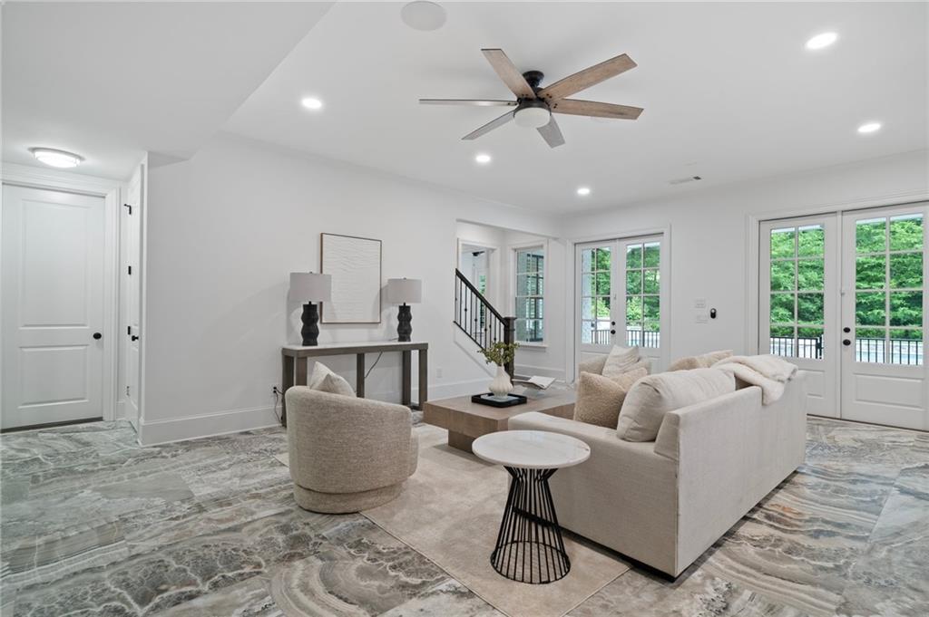 3213 Balley Forrest Drive Milton, GA 30004 - Photo 57 of 90 a living room with furniture and a wooden floor