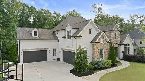 a living room with furniture a table and a fireplace