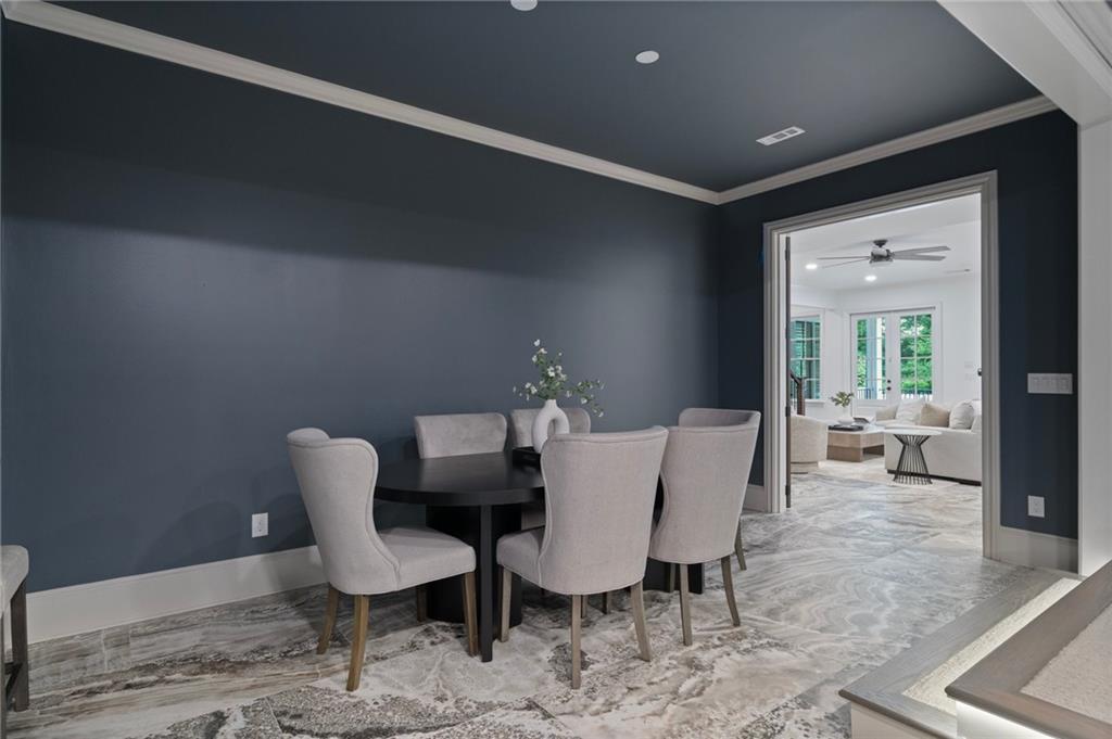 3213 Balley Forrest Drive Milton, GA 30004 - Photo 63 of 90 a view of a dining room with furniture and wooden floor