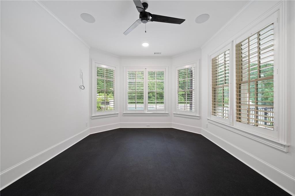 3213 Balley Forrest Drive Milton, GA 30004 - Photo 68 of 90 a view of an empty room with a window and wooden floor