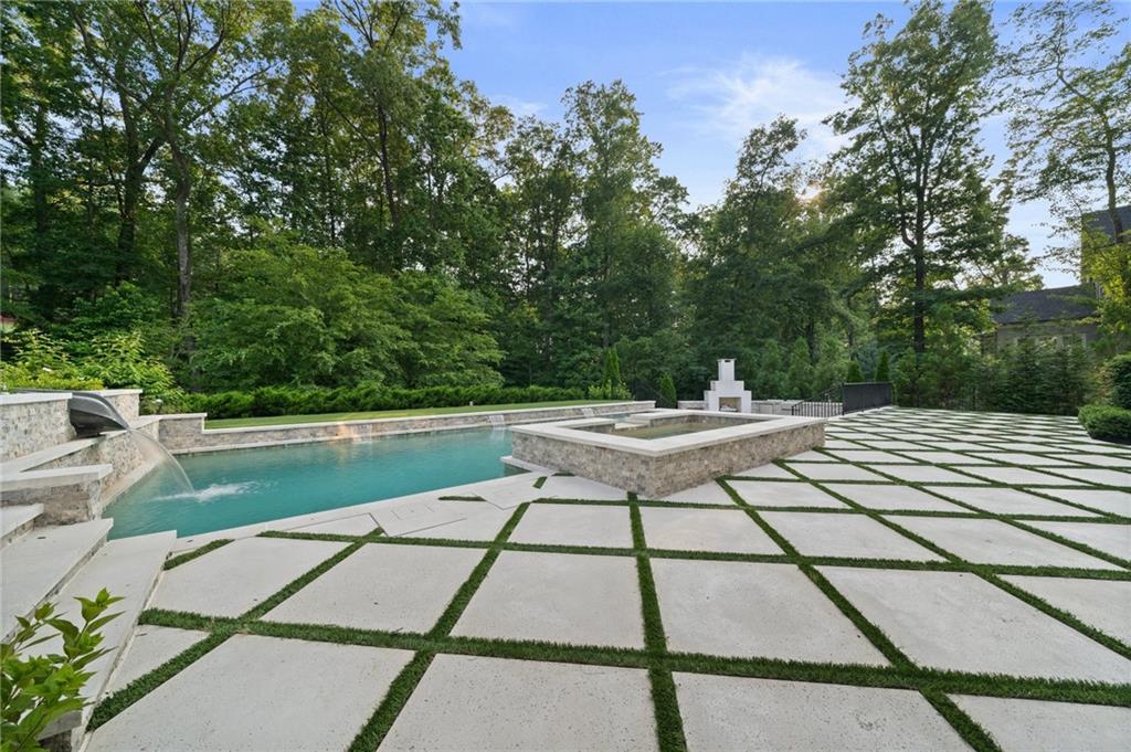 3213 Balley Forrest Drive Milton, GA 30004 - Photo 72 of 90 a view of backyard with swimming pool and seating space