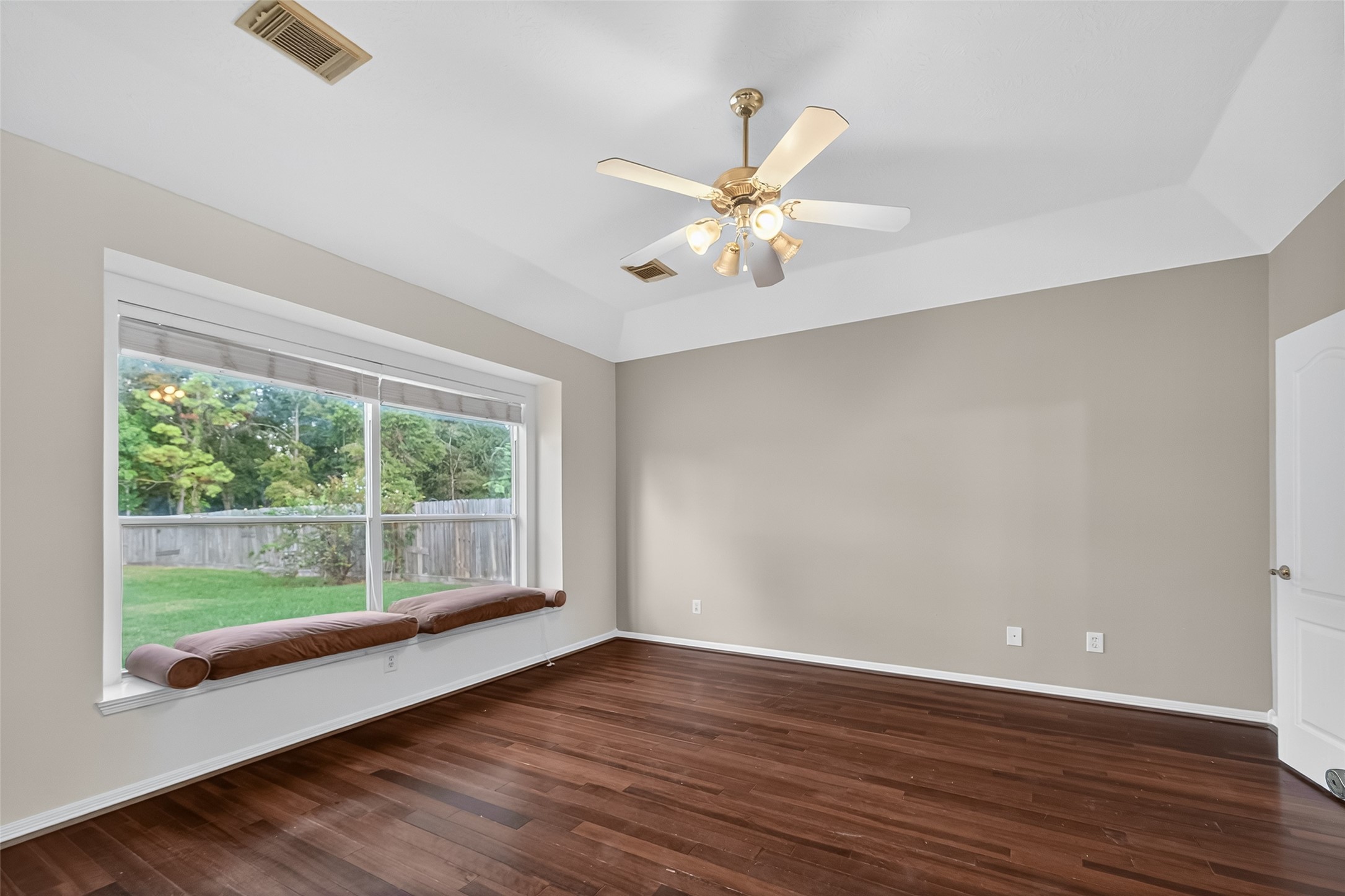 19207 Pinewood Mist Lane Humble, TX 77346 - Photo 12 of 29 wooden floor in an empty room with a window
