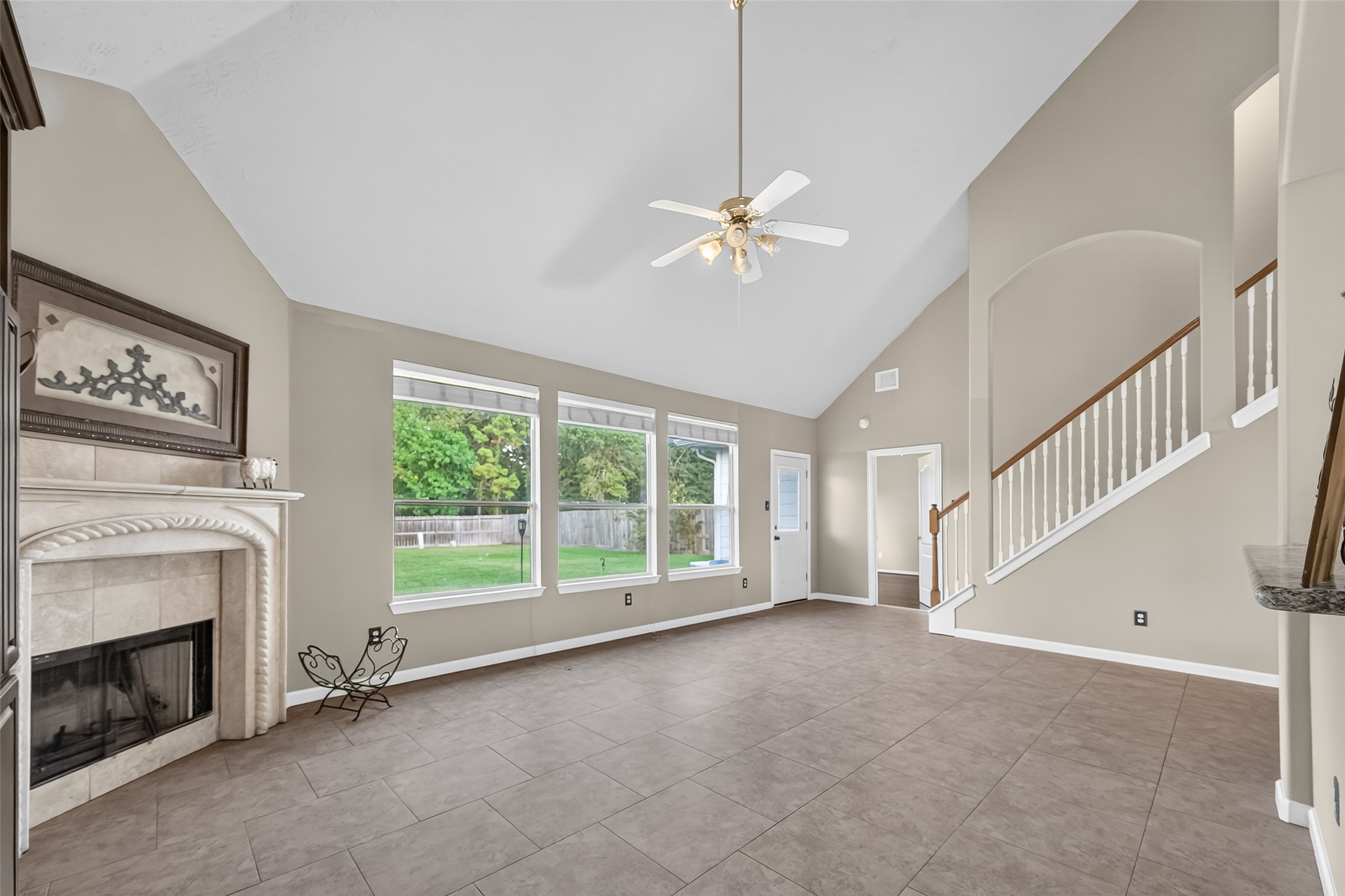 19207 Pinewood Mist Lane Humble, TX 77346 - Photo 17 of 29 a view of empty room with fireplace fan and windows