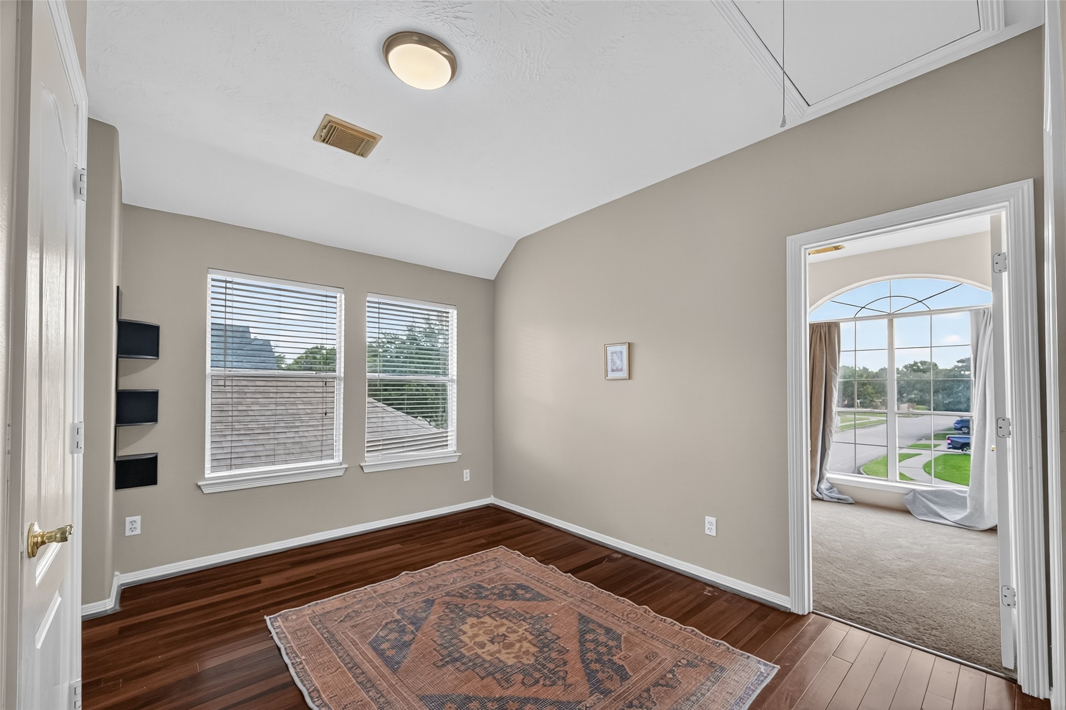 19207 Pinewood Mist Lane Humble, TX 77346 - Photo 20 of 29 a view of an empty room with wooden floor and a window
