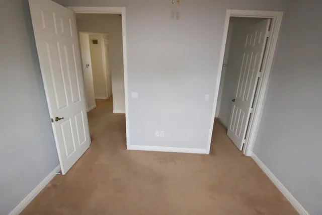 a view of a hallway with staircase