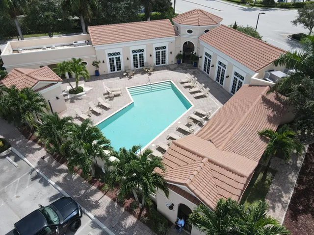 an aerial view of a house with garden space and street view
