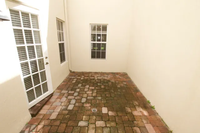 a view of empty room with windows