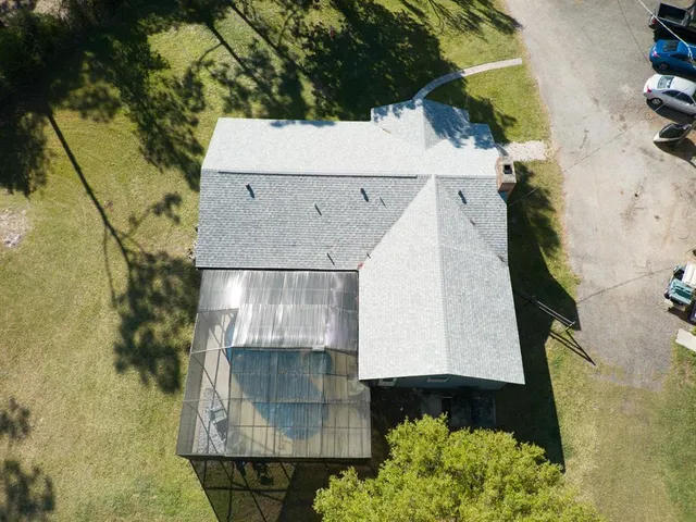 a kitchen with a sink a table and chairs