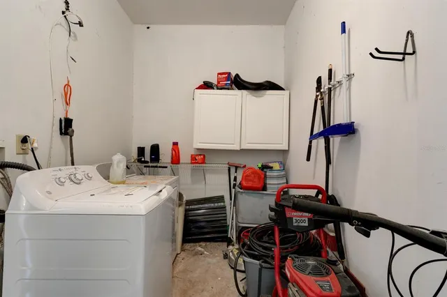 a view of a balcony with furniture and wooden floor