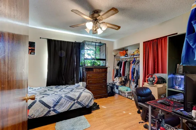 an aerial view of a house with a yard and garden