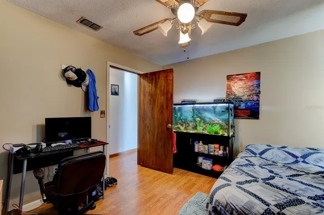 an aerial view of a house with a yard and garden