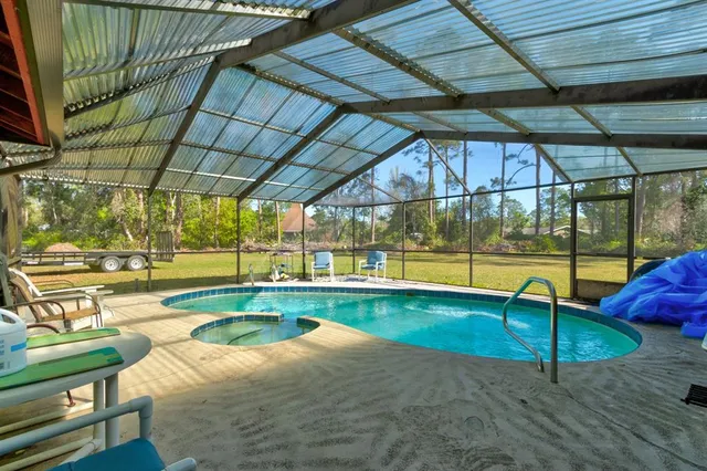 a view of a house with wooden fence