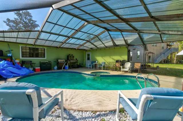 a kitchen with stainless steel appliances granite countertop a stove top oven a sink a counter space and cabinets