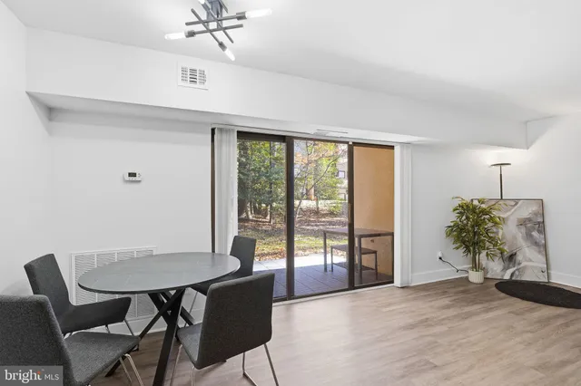 a view of a livingroom with furniture and a window