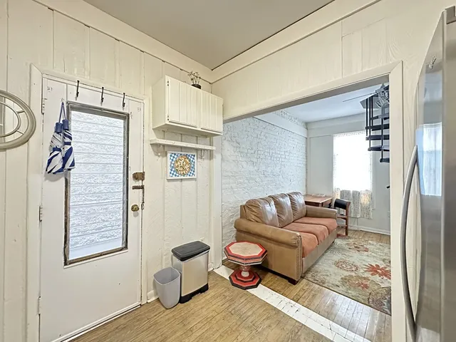 a living room with furniture and a rug