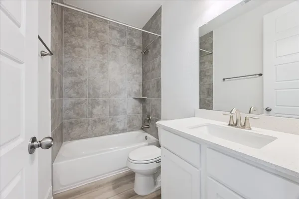 a bathroom with a toilet a sink and a bathtub