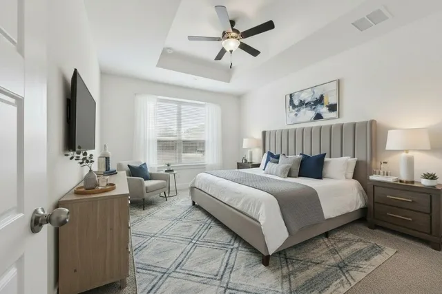 a bed room with a bed and a couch